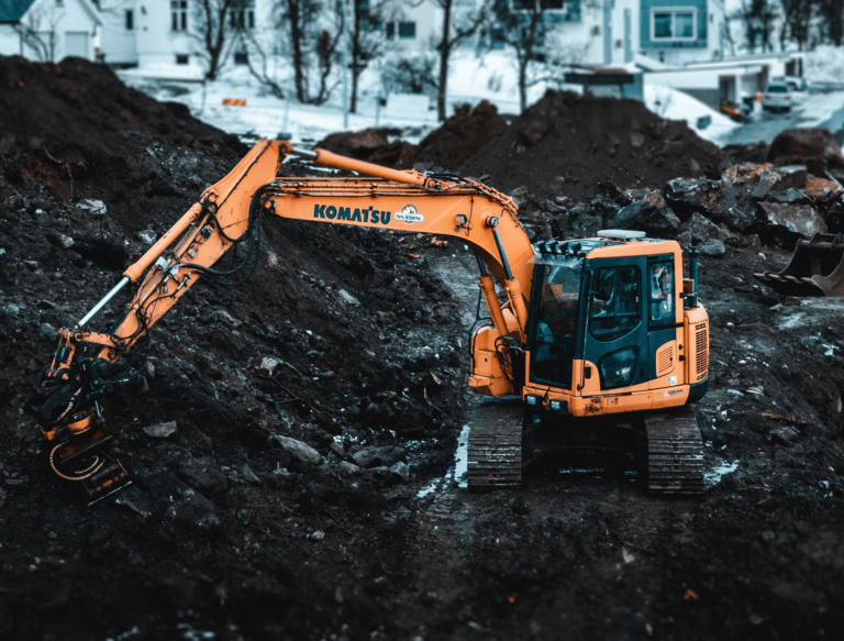 Construction Site with Excavator in the Winter
